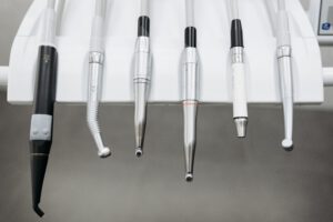 Prophylaxe Close-up view of dental instruments organized in a holder, ready for use.
